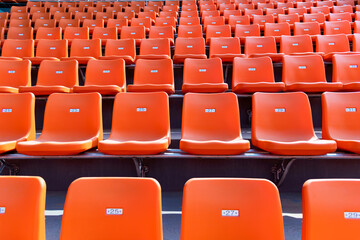 Empty orange seat in stadium