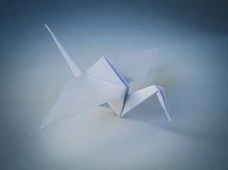 White paper crane origami isolated on blank background