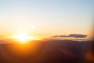 Fototapeta na wymiar Beautiful sunset over the mountain