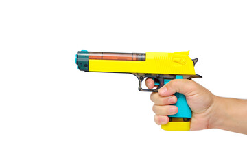 Toy gun in hand on a white background, isolate.