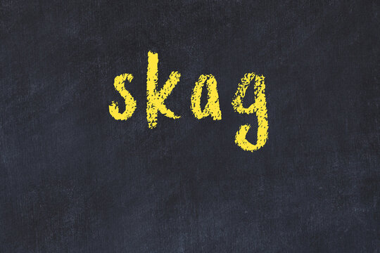 College chalk desk with the word skag written on in
