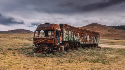  a burnt-out truck in the field. Burnt abandoned car © Roman