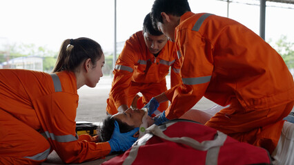 Emergency medical technician Asian woman (EMT) or paramedic team is holding manual stabilization of the head patients, Emergency medical services (EMS) nurses concept - 535862146