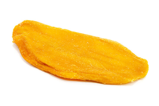Mango isolate. Pieces of dried mango on a white background close-up