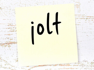 Yellow sheet of paper with word jolt. Reminder concept - obrazy, fototapety, plakaty