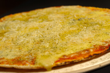 Cheese pizza served on wooden board