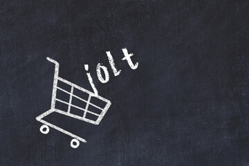 Chalk drawing of shopping cart and word jolt on black chalboard. Concept of globalization and mass consuming