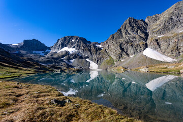 View of a blue mountain lake in the Caucasus Russia against the background of impressive steep mountain peaks