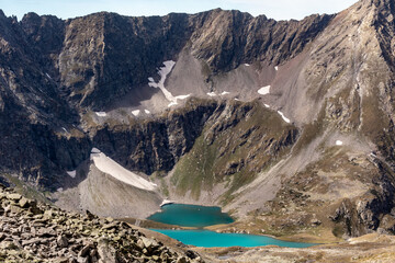 View of a blue mountain lake in the Caucasus Russia against the background of impressive steep mountain peaks