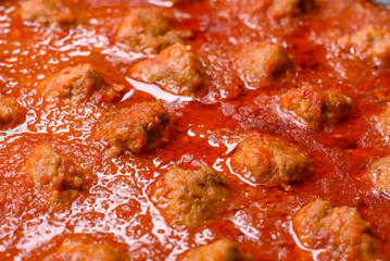 Delicious meatballs made from ground beef in a spicy tomato sauce