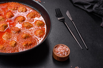 Delicious meatballs made from ground beef in a spicy tomato sauce