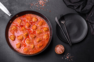 Delicious meatballs made from ground beef in a spicy tomato sauce