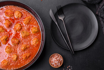 Delicious meatballs made from ground beef in a spicy tomato sauce
