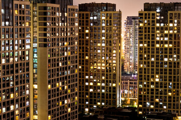 Fototapeta na wymiar Modern buildings with lights at night