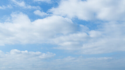 Naklejka na ściany i meble Blue sky with big white clouds
