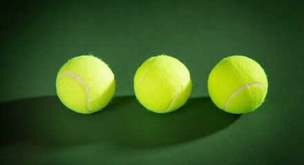 Tennis ball on the green background.