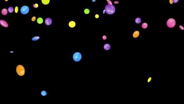 Falling colorful smarties. Isolated sweets with black background. 29,97 fps