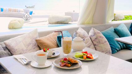 Served breakfast in outdoors cafe with sea view, hotel sweet lunch