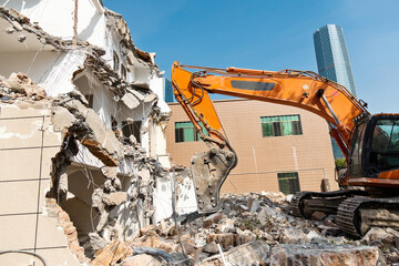 Construction machinery is demolishing the house