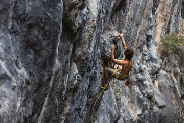 rock climber climbs the rock.