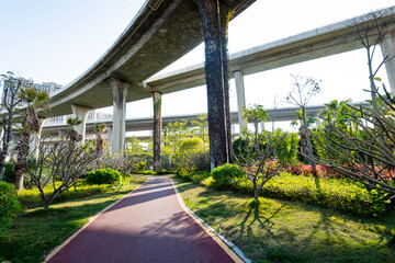 Fototapeta premium Red sidewalk under the overpass