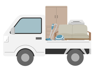 不用品を積んだ横向きの軽トラック2