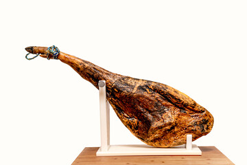 spanish iberian ham in ham holder on wooden table