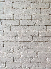 Monochrome brick wall of identical bricks for the entire background