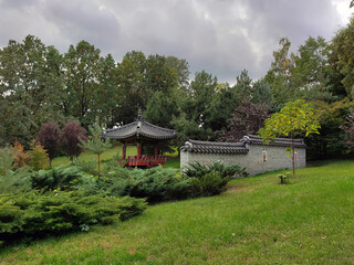 A Korean religious temple and part of its wall in a public park