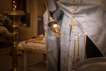 Priest prepares baptism ritual