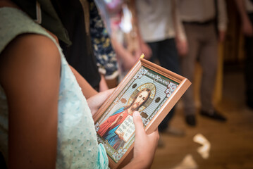 Woman holds an icon