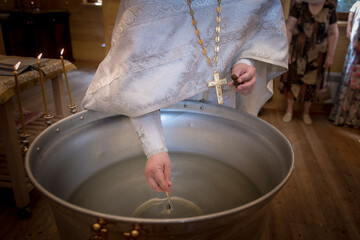 Priest prepares baptism ritual