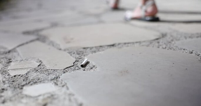 Cigarette butts on street and fine for garbage thrown on street