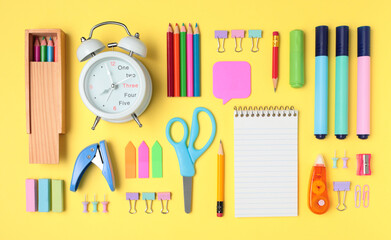 School and office supplies on yellow background, mock-up top view