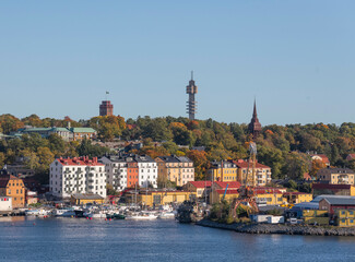 Harbor view and towers on the museum island Djurgården a colorful sunny autumn day in Stockholm