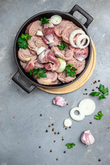 Stomachs chicken in pan. Raw uncooked chicken gizzards, stomach. Culinary, cooking, concept. vertical image. top view. place for text