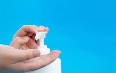 Woman hands using liquid soap