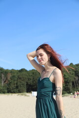 beautiful girl in a dress on the beach