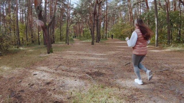 Girl running in autumn forest, fpv shooting, autumn forest, fpv shooting running