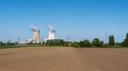 Doel, East - Flanders - Belgium -  Cooling towers of the nuclear power reactors with agricultural...