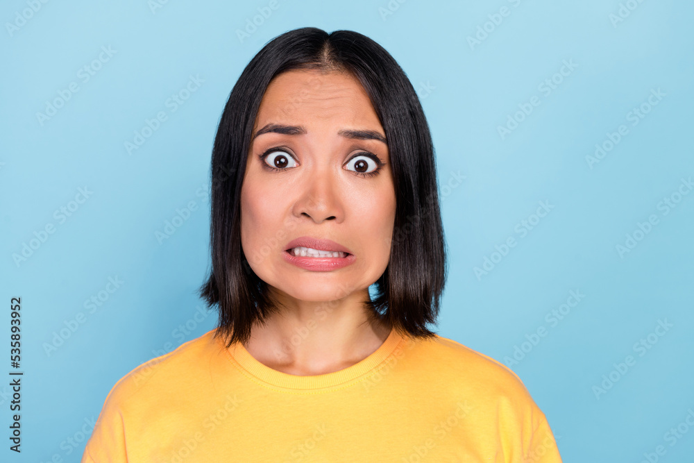 Sticker Portrait of nice pretty lovely girl with straight hairstyle dressed yellow t-shirt scared staring isolated on blue color background