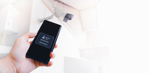 Sign in to the mobile phone app for a CCTV IP camera by own with horizontal banner copy space, Home...