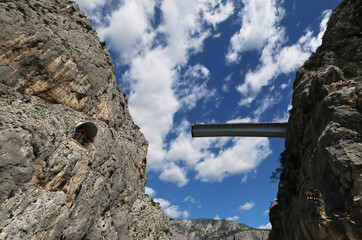 New bridge construction passing through two opposite rocky cliffs at the town of Omis, Croatia 