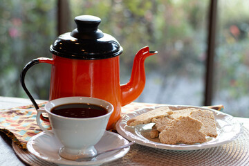 traditional brazilian coffee with homemade cookies crackers and teapot