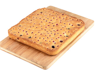 Closed freshly baked berry pie on a cutting board. Homemade pie with blueberries and currants.