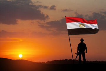 Silhouette Of A Solider Against the Sunrise in desert . Concept - armed forces of Egypt. Egypt...