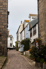 Fototapeta na wymiar Bunkers Hill, a narrow lane in the maze of narrow cobbled streets and fisherman’s cottages in the heart of old St Ives, known as Downalong, in Cornwall, UK