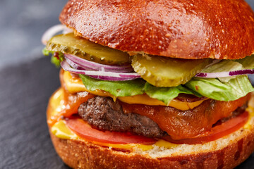 tasty burger with beef cutlet and vegetables