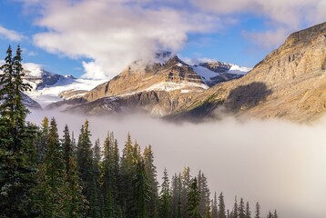 Misty Clouds Over Banff Mountains