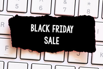 Black Friday words written on a piece of paper. Time for promotions and sales in stores.